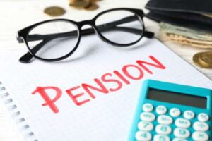 The words pension with a calculator and glasses